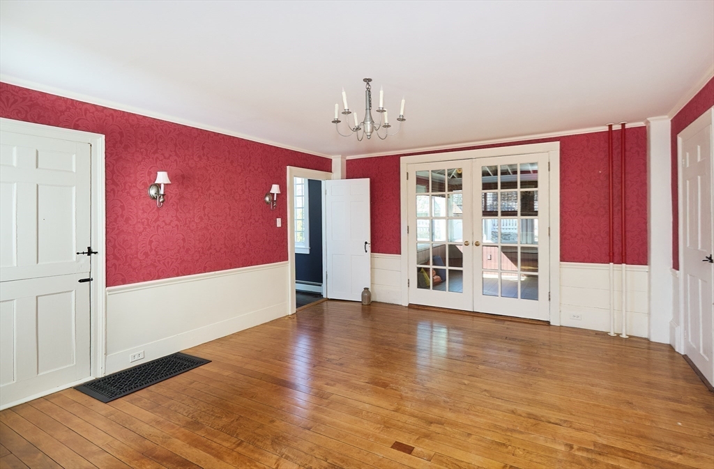 685 Highland Street Marshfield, MA 02050 - Photo 15 of 38 a view of an empty room with window and wooden floor
