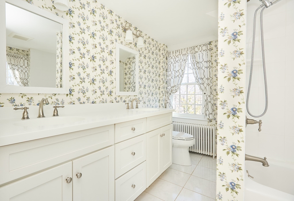 685 Highland Street Marshfield, MA 02050 - Photo 20 of 38 a bathroom with a double vanity sink toilet and shower