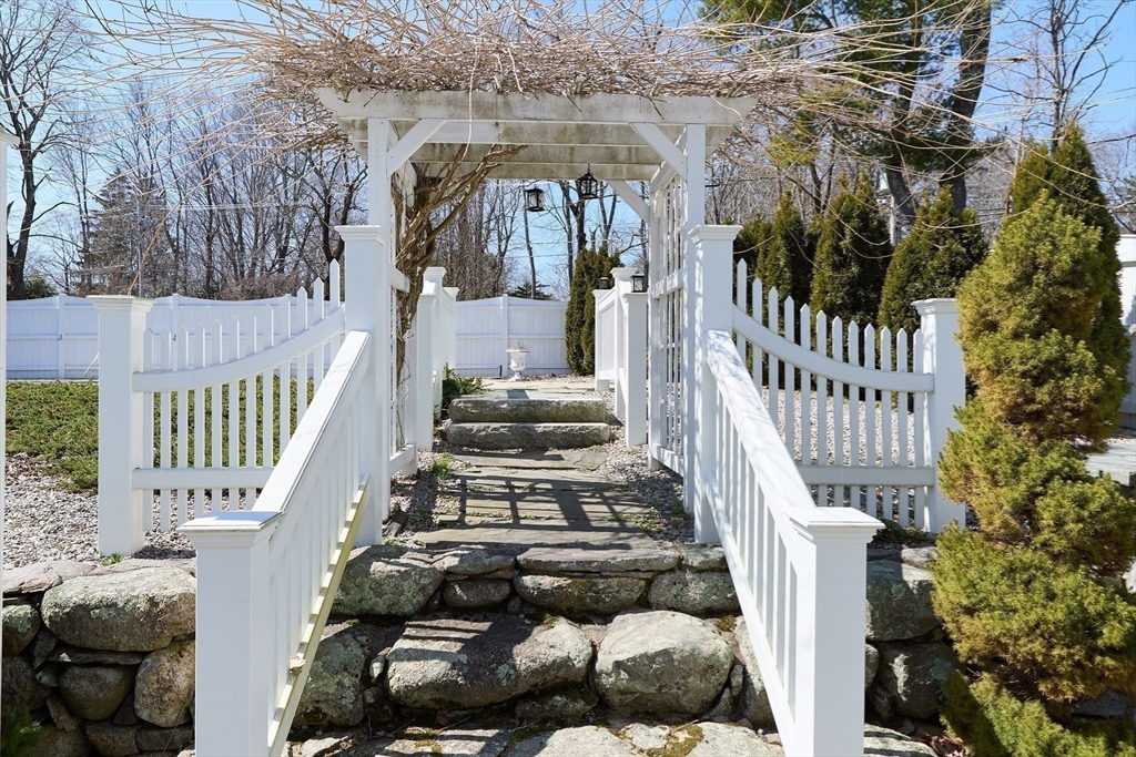 685 Highland Street Marshfield, MA 02050 - Photo 30 of 38 a view of a house with a small yard
