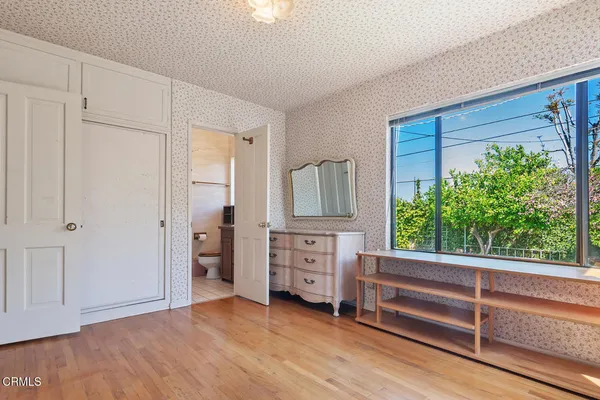 a view of room with window and cabinet