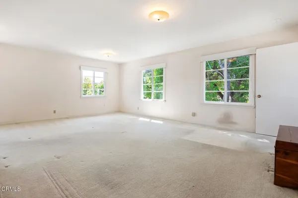 an empty room with windows