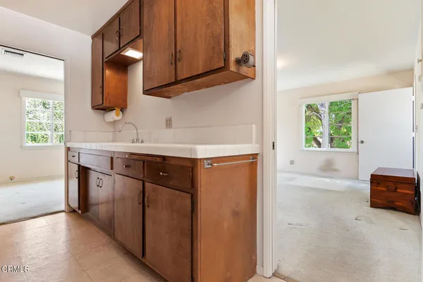 a kitchen with stainless steel appliances a sink and a cabinets
