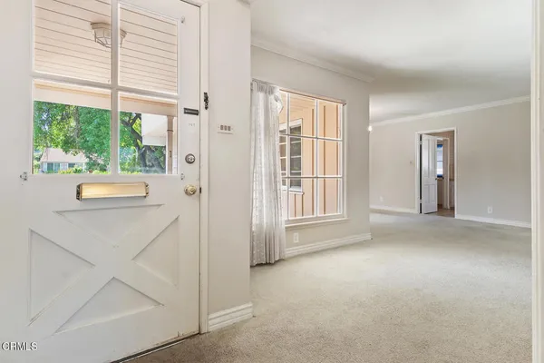 a view of livingroom with furniture and windows