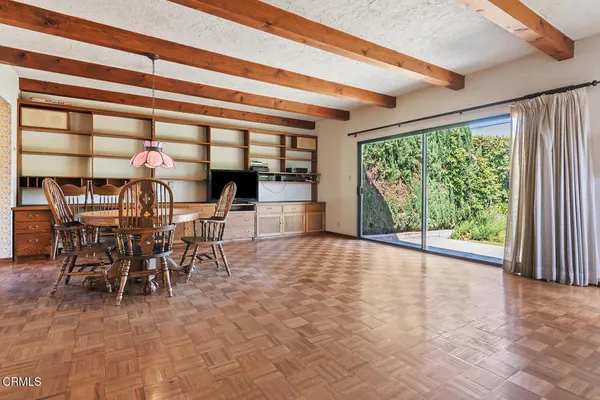 a view of a dining room with furniture window and outside view