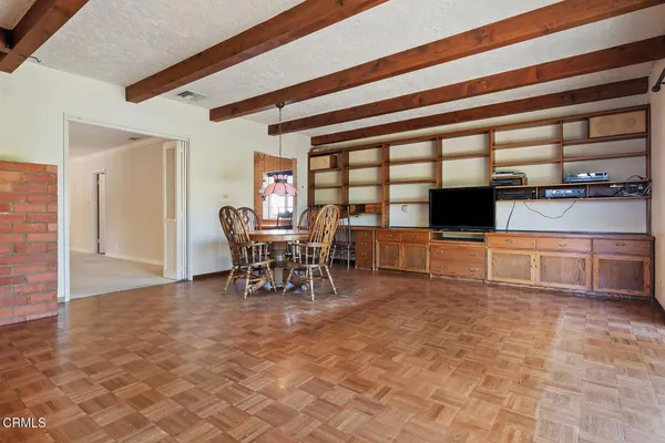 a view of kitchen with microwave and furniture