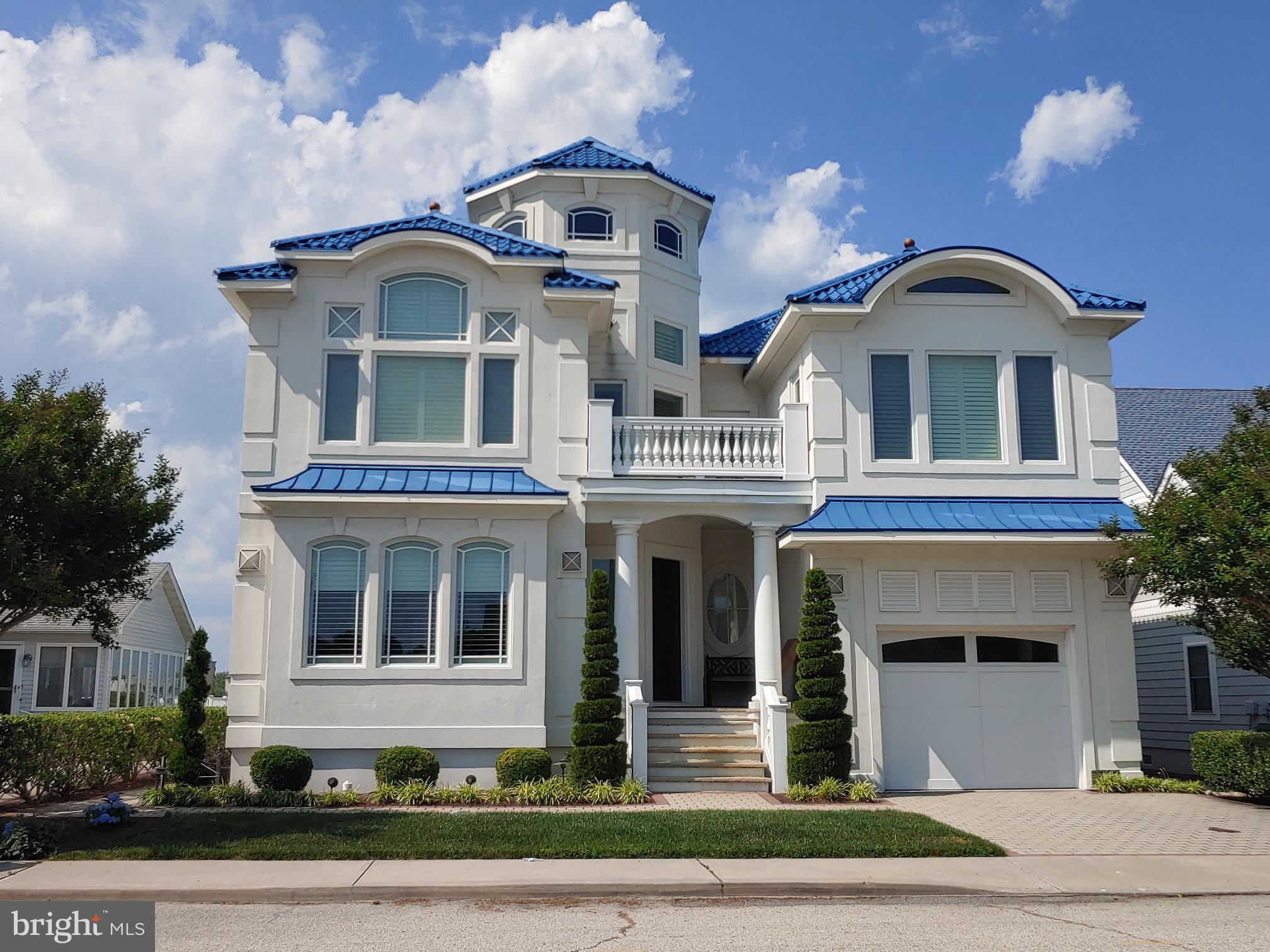 160 Channel Buoy Road Ocean City, MD 21842 - Photo 1 of 71 a front view of a house