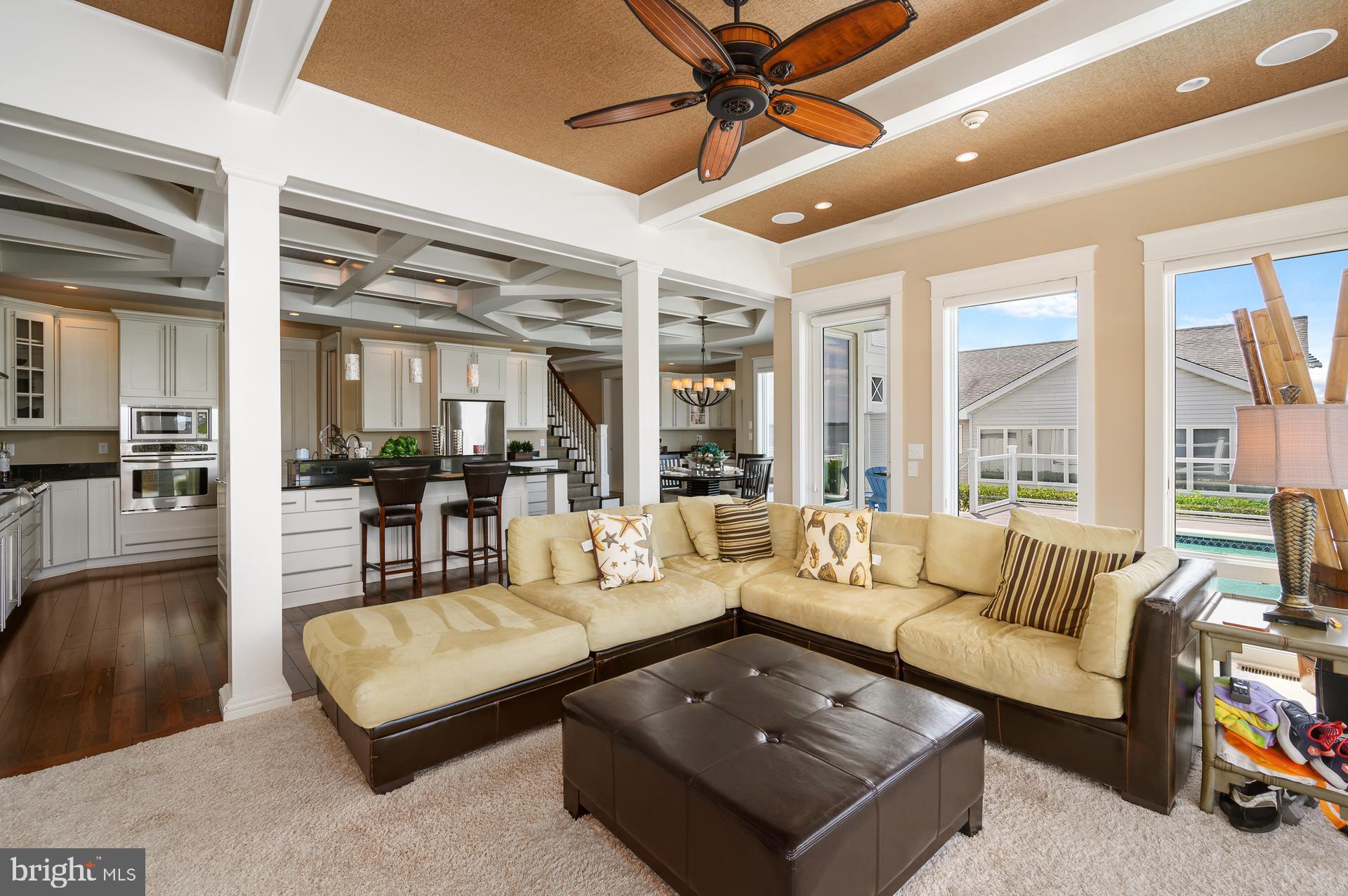 160 Channel Buoy Road Ocean City, MD 21842 - Photo 15 of 71 a living room with furniture and a large window