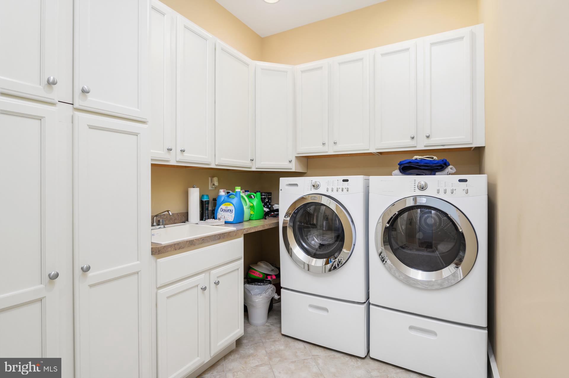160 Channel Buoy Road Ocean City, MD 21842 - Photo 19 of 71 a utility room with sink dryer and washer