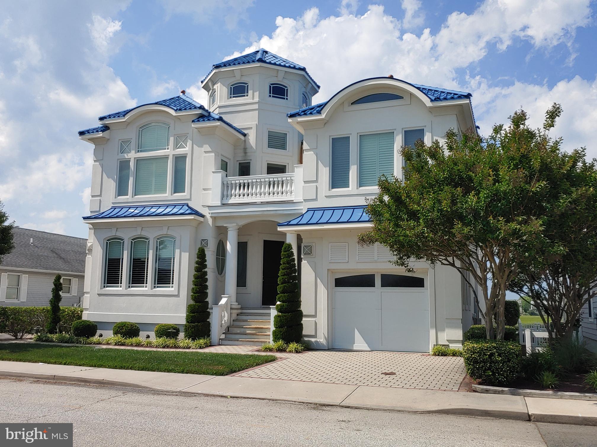 160 Channel Buoy Road Ocean City, MD 21842 - Photo 2 of 71 front view of a house with a yard