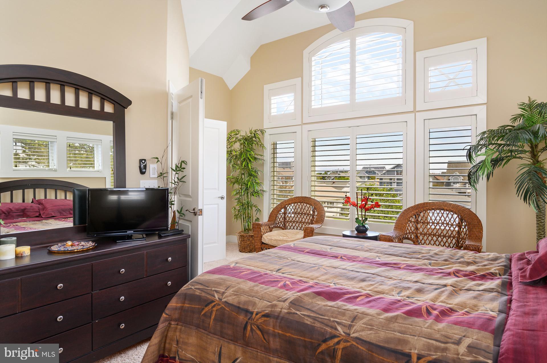 160 Channel Buoy Road Ocean City, MD 21842 - Photo 28 of 71 a bedroom with a bed and a flat screen tv