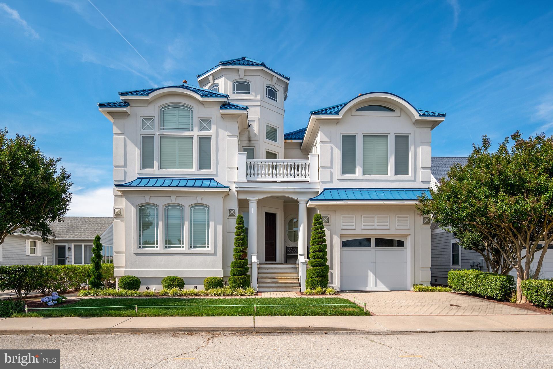 160 Channel Buoy Road Ocean City, MD 21842 - Photo 3 of 71 a front view of a house with a garden