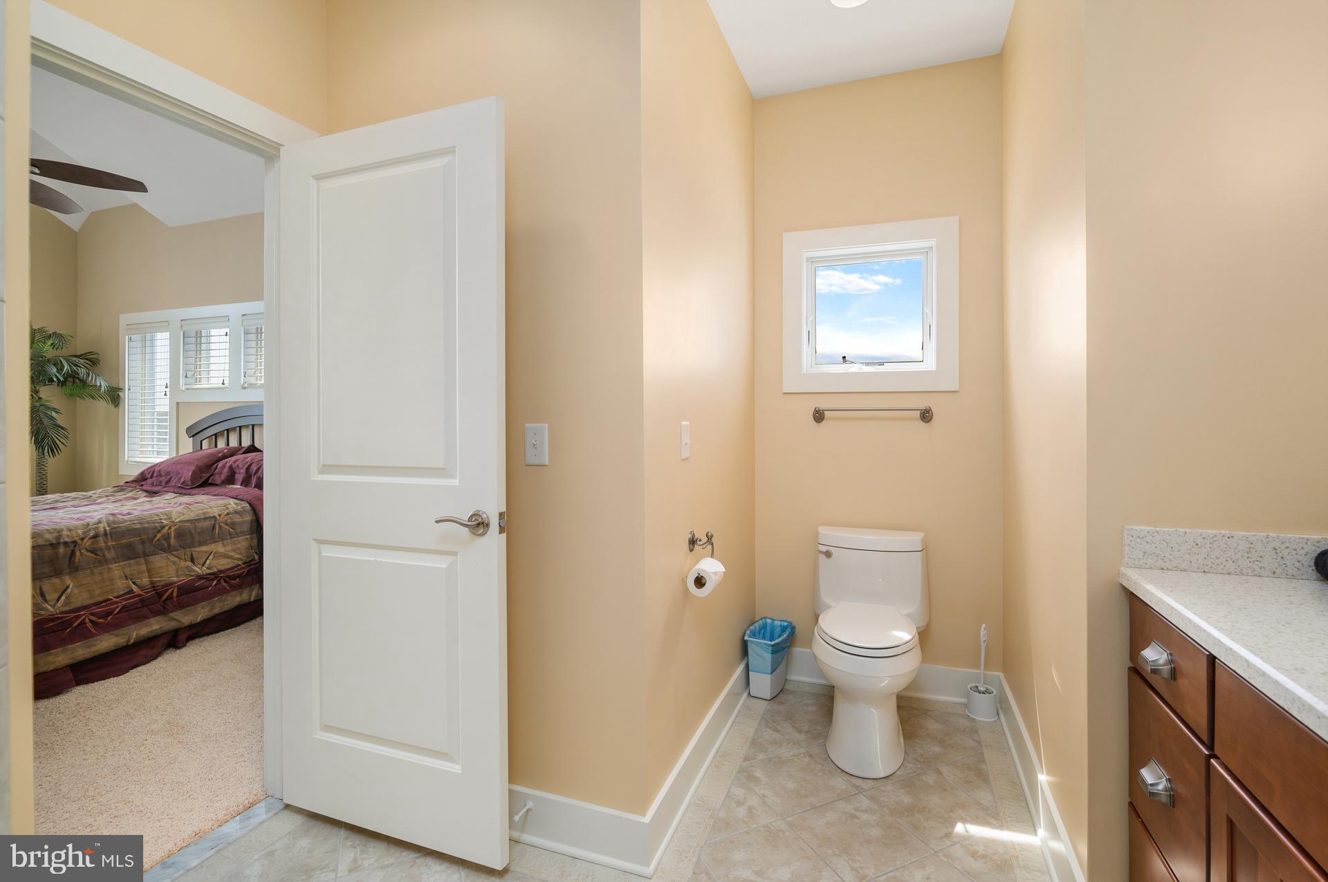 160 Channel Buoy Road Ocean City, MD 21842 - Photo 31 of 71 a bathroom with a sink and a toilet