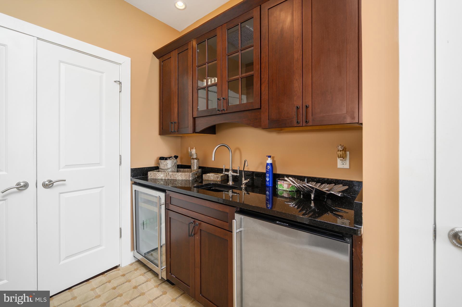 160 Channel Buoy Road Ocean City, MD 21842 - Photo 37 of 71 a kitchen with granite countertop a sink and cabinets