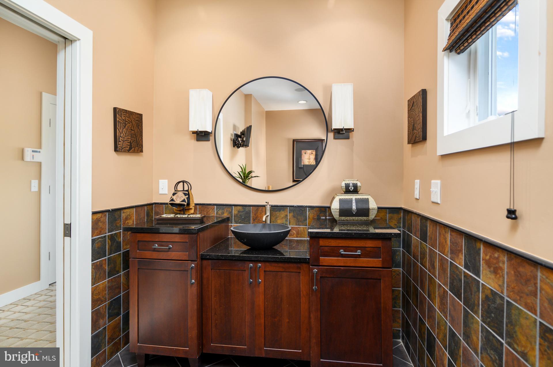 160 Channel Buoy Road Ocean City, MD 21842 - Photo 39 of 71 a living room with furniture and a mirror