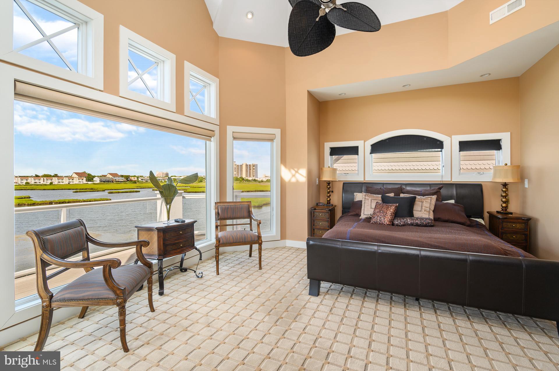 160 Channel Buoy Road Ocean City, MD 21842 - Photo 41 of 71 a bedroom with a bed and wooden floor