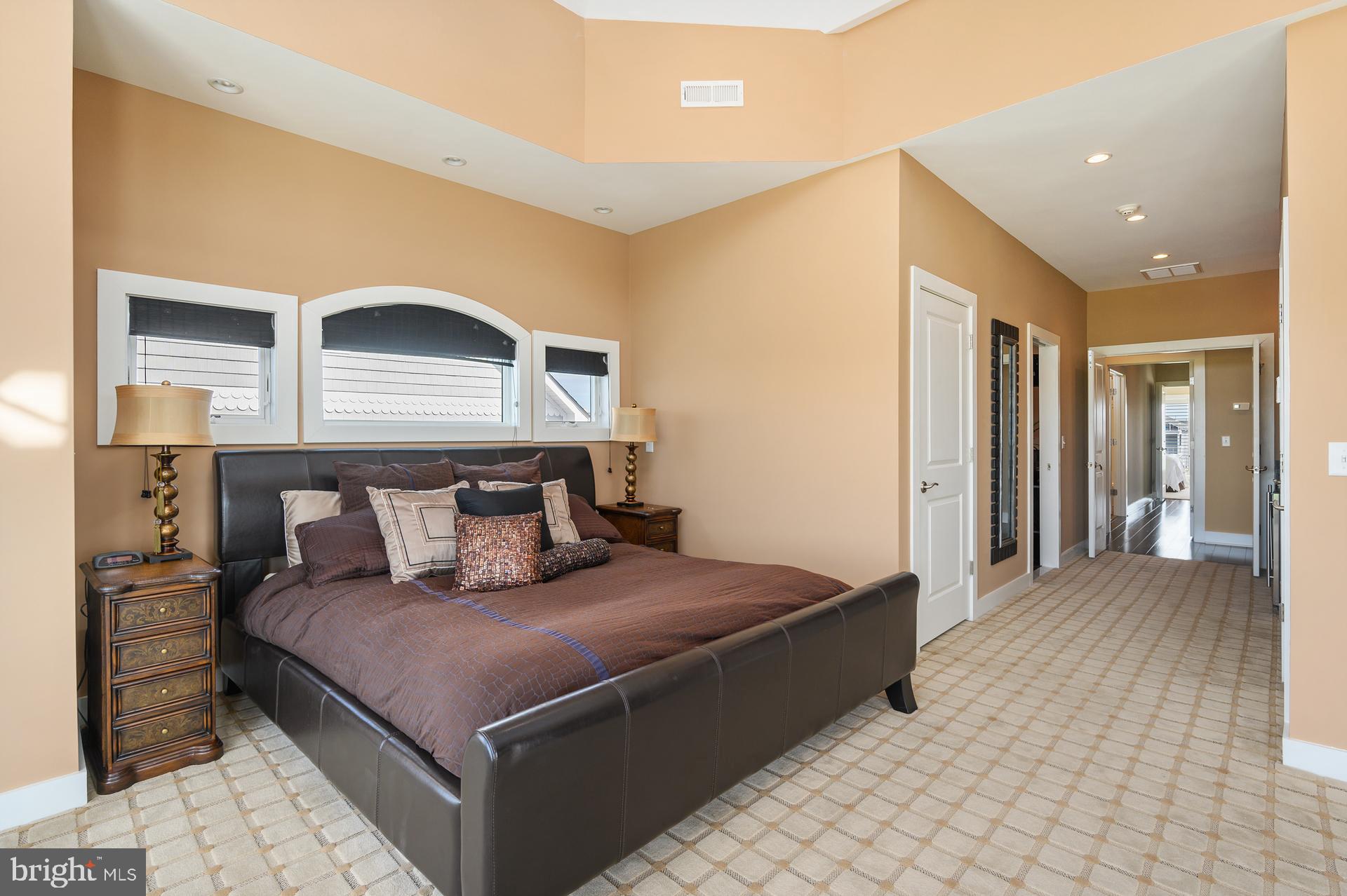 160 Channel Buoy Road Ocean City, MD 21842 - Photo 42 of 71 a bed room with a bed and a night stand