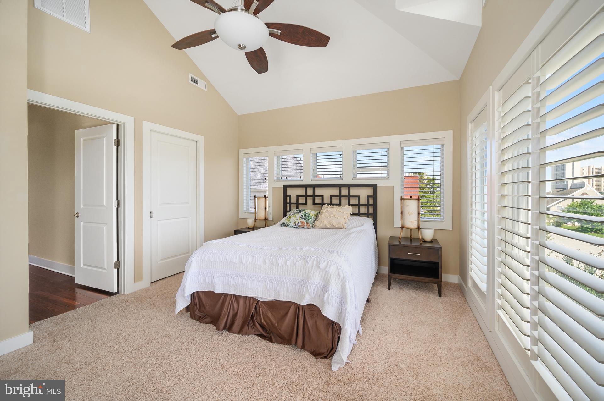 160 Channel Buoy Road Ocean City, MD 21842 - Photo 50 of 71 a bedroom with a bed and a window