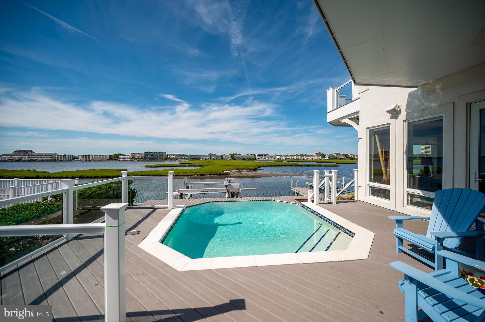 160 Channel Buoy Road Ocean City, MD 21842 - Photo 55 of 71 a view of a swimming pool with seating space