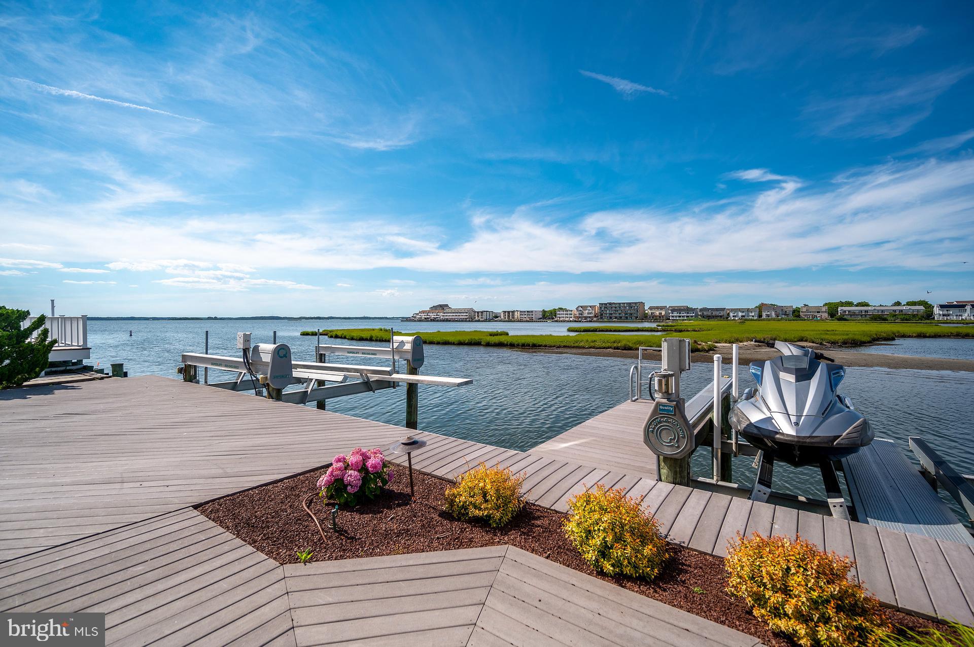 160 Channel Buoy Road Ocean City, MD 21842 - Photo 57 of 71 a view of a swimming pool and lounge chair