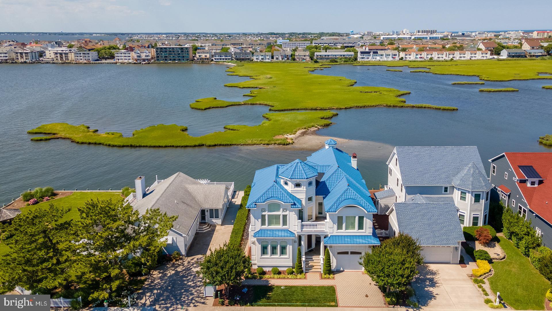 160 Channel Buoy Road Ocean City, MD 21842 - Photo 61 of 71 an aerial view of residential houses with outdoor space and swimming pool