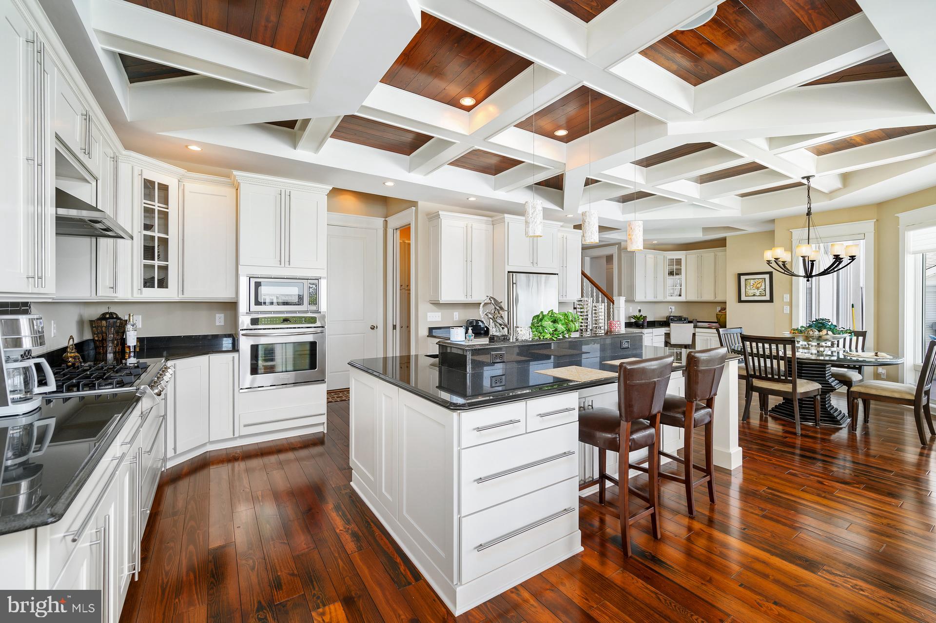 160 Channel Buoy Road Ocean City, MD 21842 - Photo 10 of 71 a living room with stainless steel appliances granite countertop furniture wooden floor and a view of kitchen
