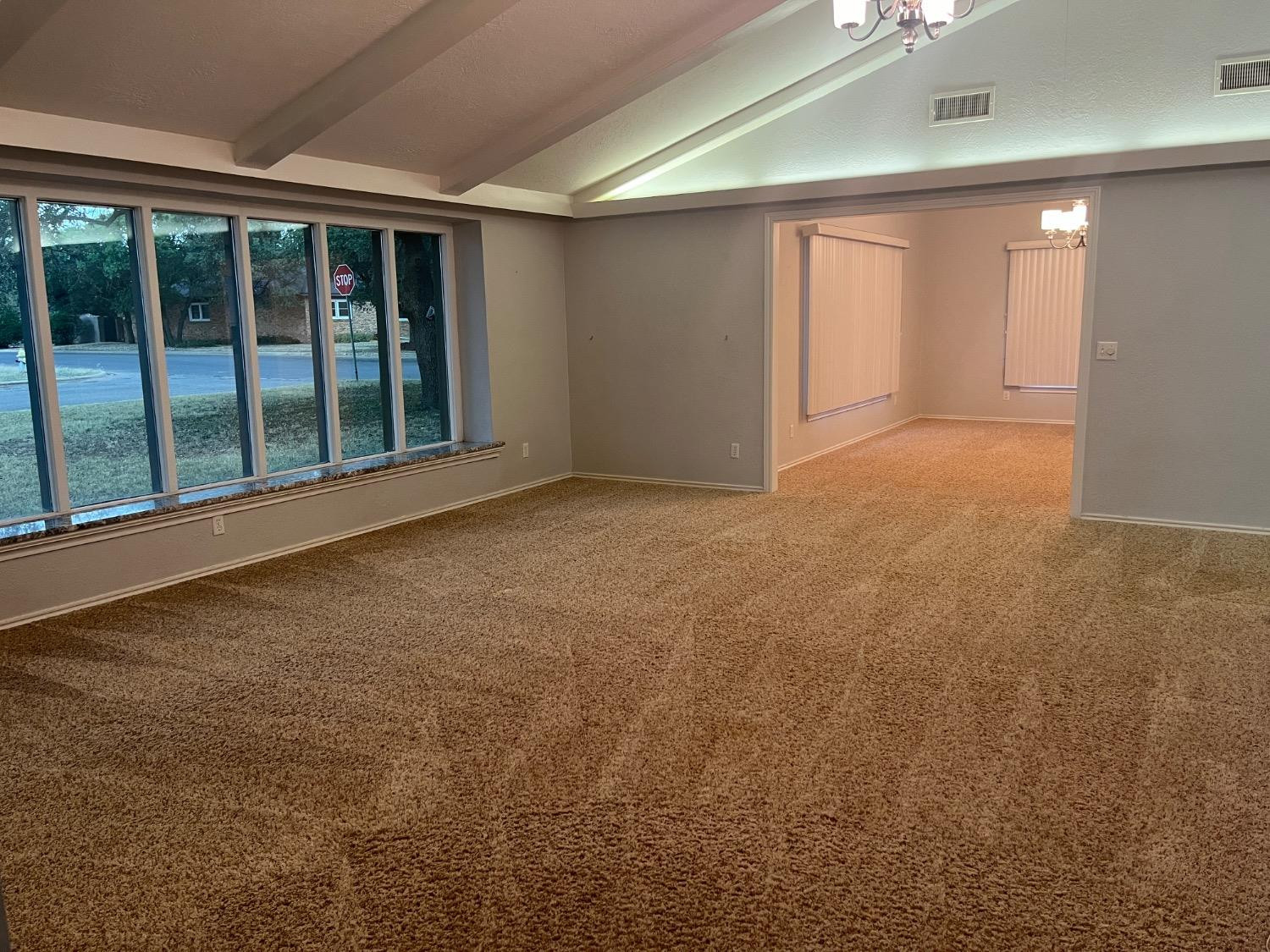 710 North 17th Street Lamesa, TX 79331 - Photo 8 of 41 a view of an empty room with a window