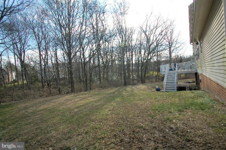 2314 Falling Creek Road Silver Spring, MD 20904 - Photo 15 of 16 a view of a backyard with large trees