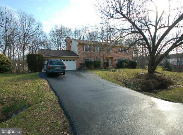 2314 Falling Creek Road Silver Spring, MD 20904 - Photo 16 of 16 a front view of a house with a yard and garage