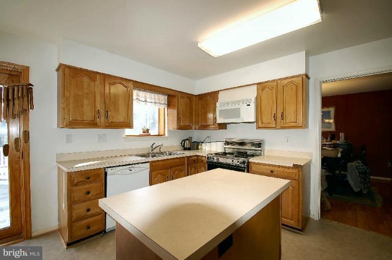 2314 Falling Creek Road Silver Spring, MD 20904 - Photo 4 of 16 a kitchen with a stove a sink dishwasher and a refrigerator