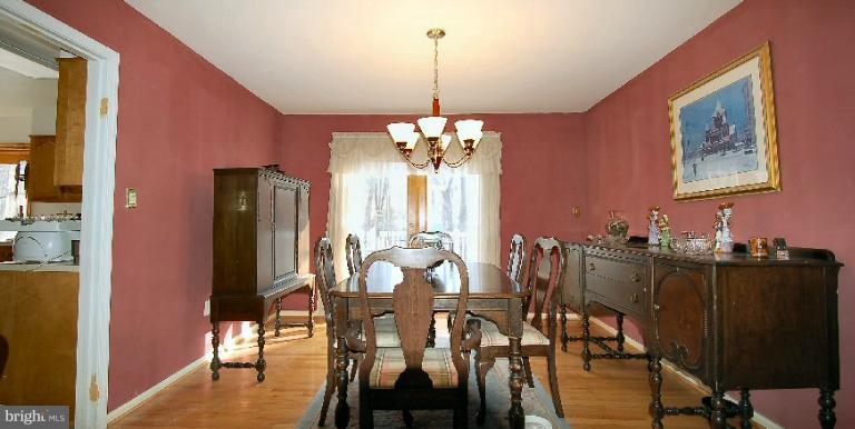 2314 Falling Creek Road Silver Spring, MD 20904 - Photo 6 of 16 a view of a dining room with furniture and chandelier
