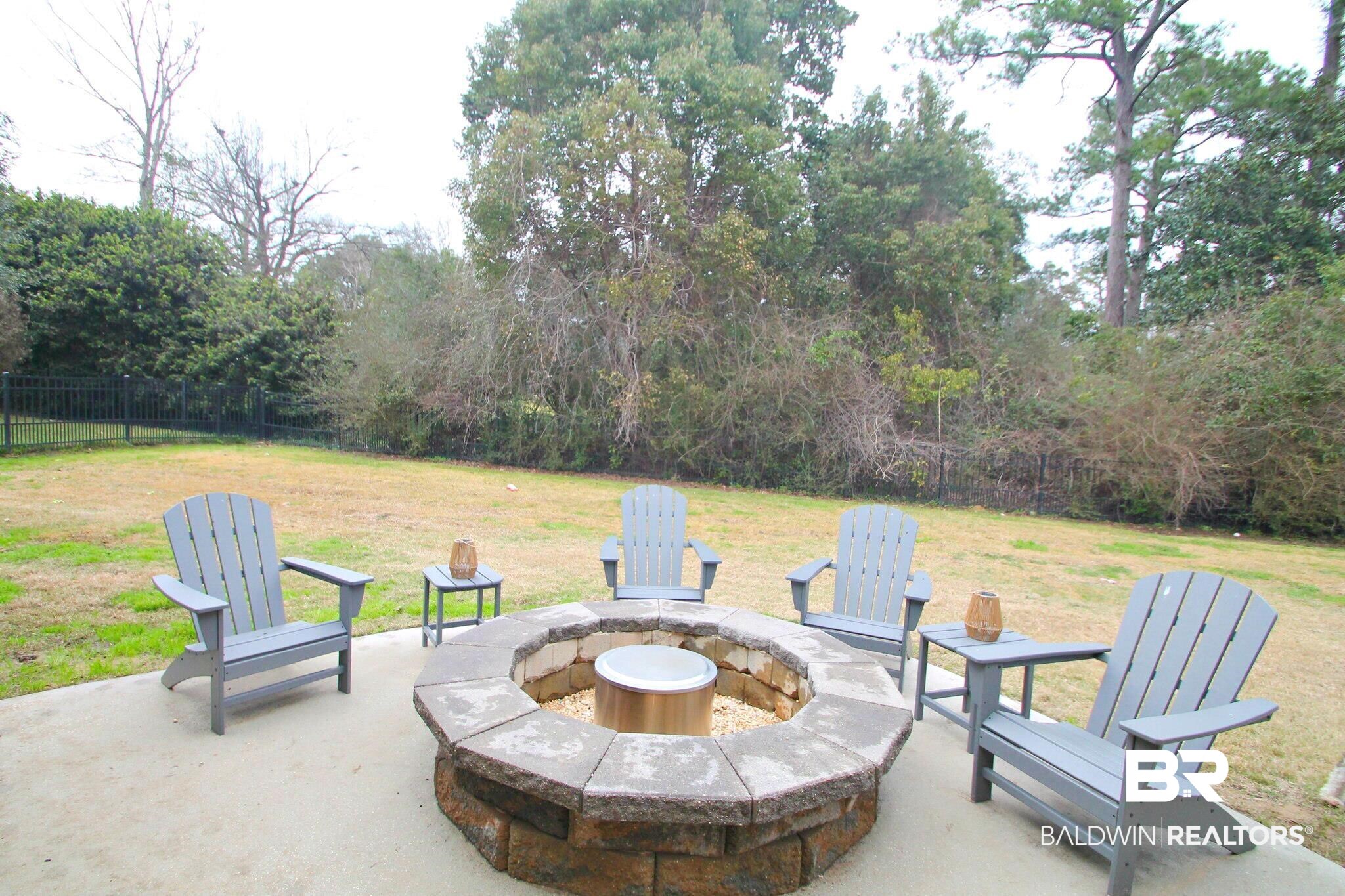 30232 Persimmon Drive Daphne, AL 36527 - Photo 24 of 27 View of patio with fence and a fire pit