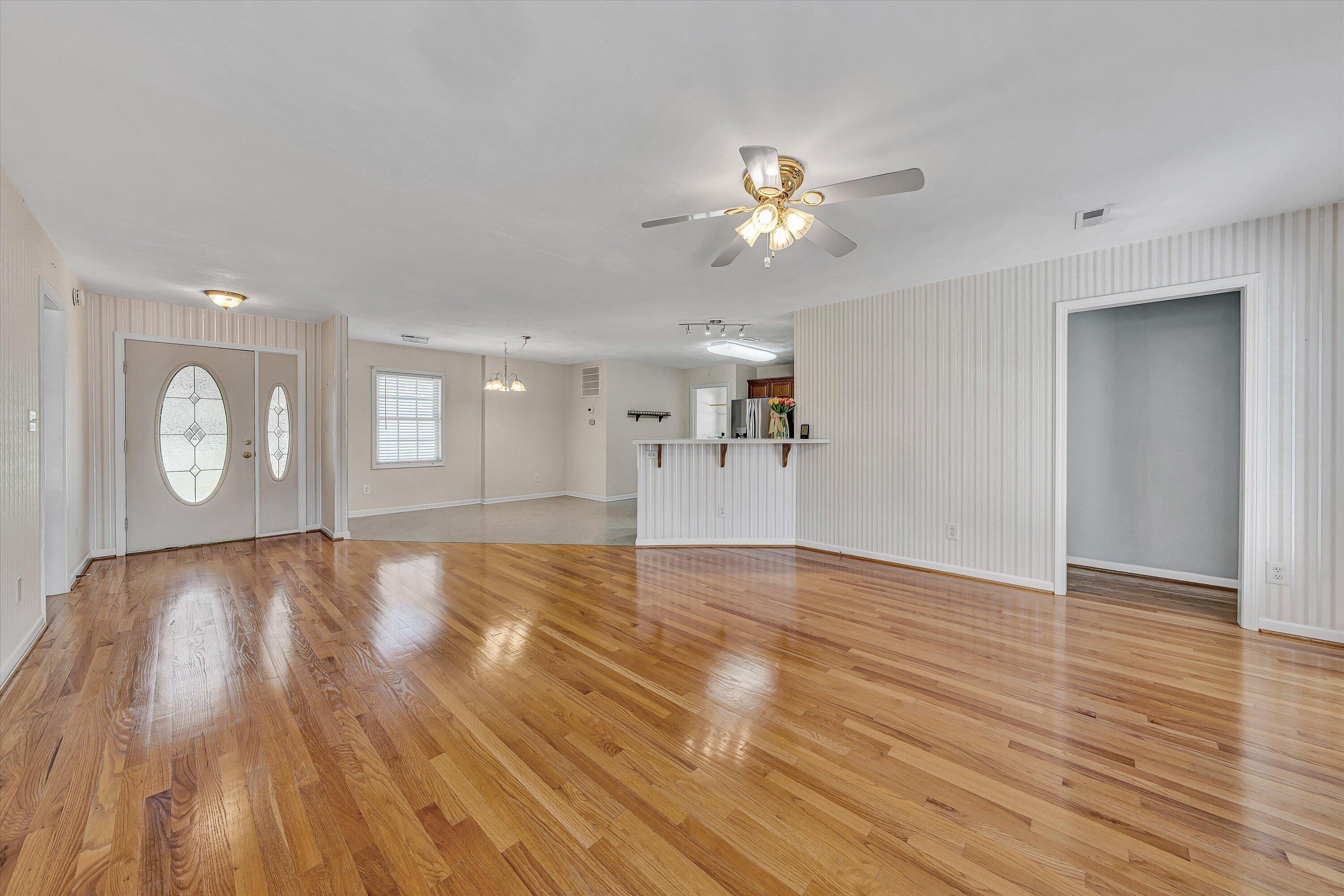 3516 Pinnacle Ridge Road Northeast Roanoke, VA 24012 - Photo 10 of 39 a view of an empty room with window and wooden floor