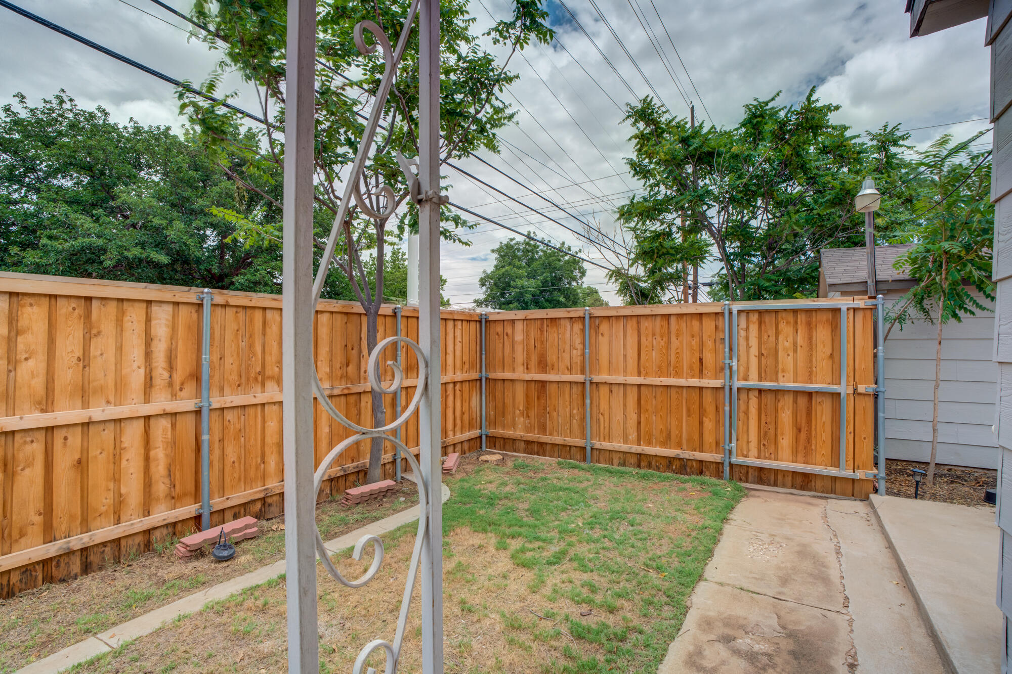 2826 33rd Street Lubbock, TX 79410 - Photo 24 of 33 a view of a backyard with wooden fence