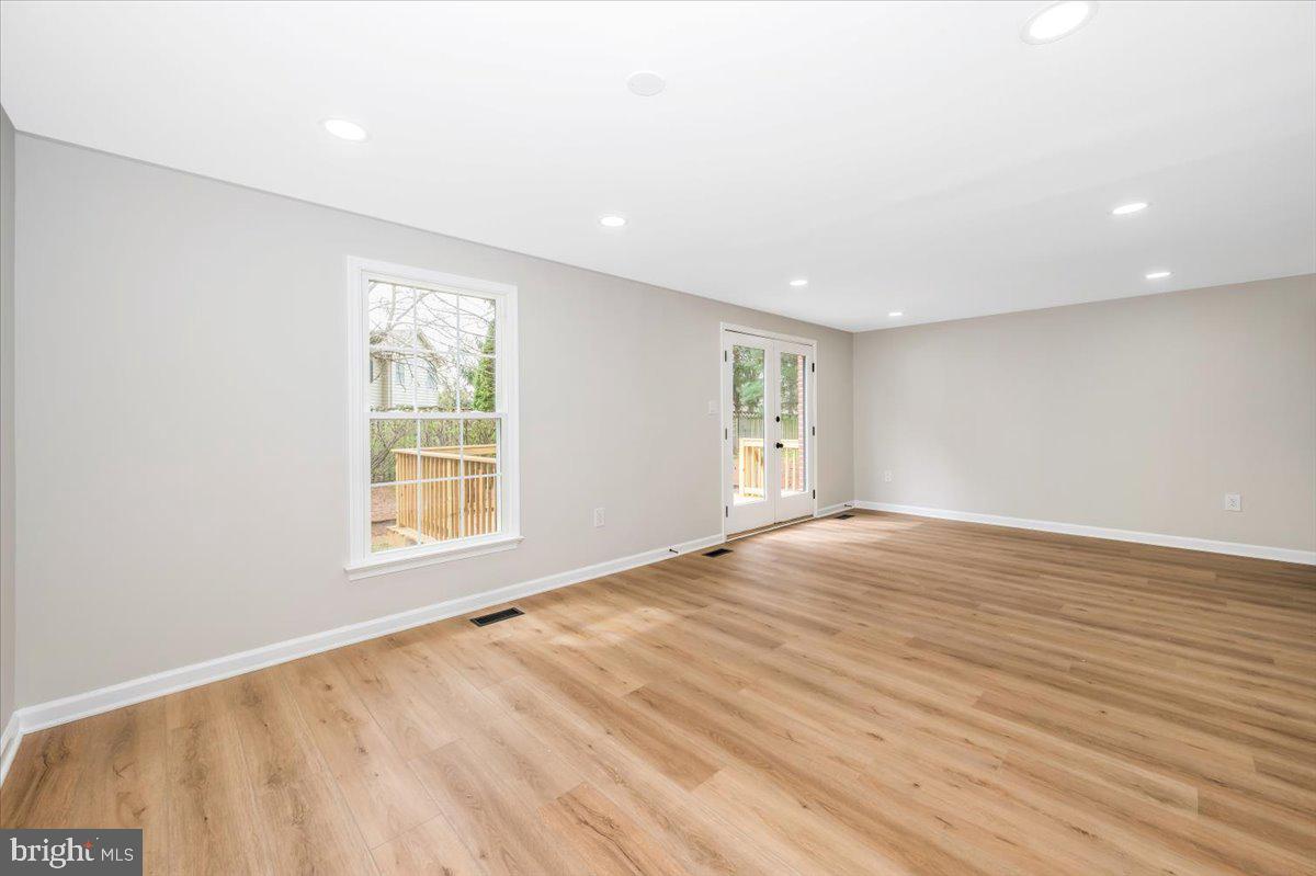 8200 Red Wing Court Frederick, MD 21701 - Photo 14 of 40 an empty room with wooden floor and windows