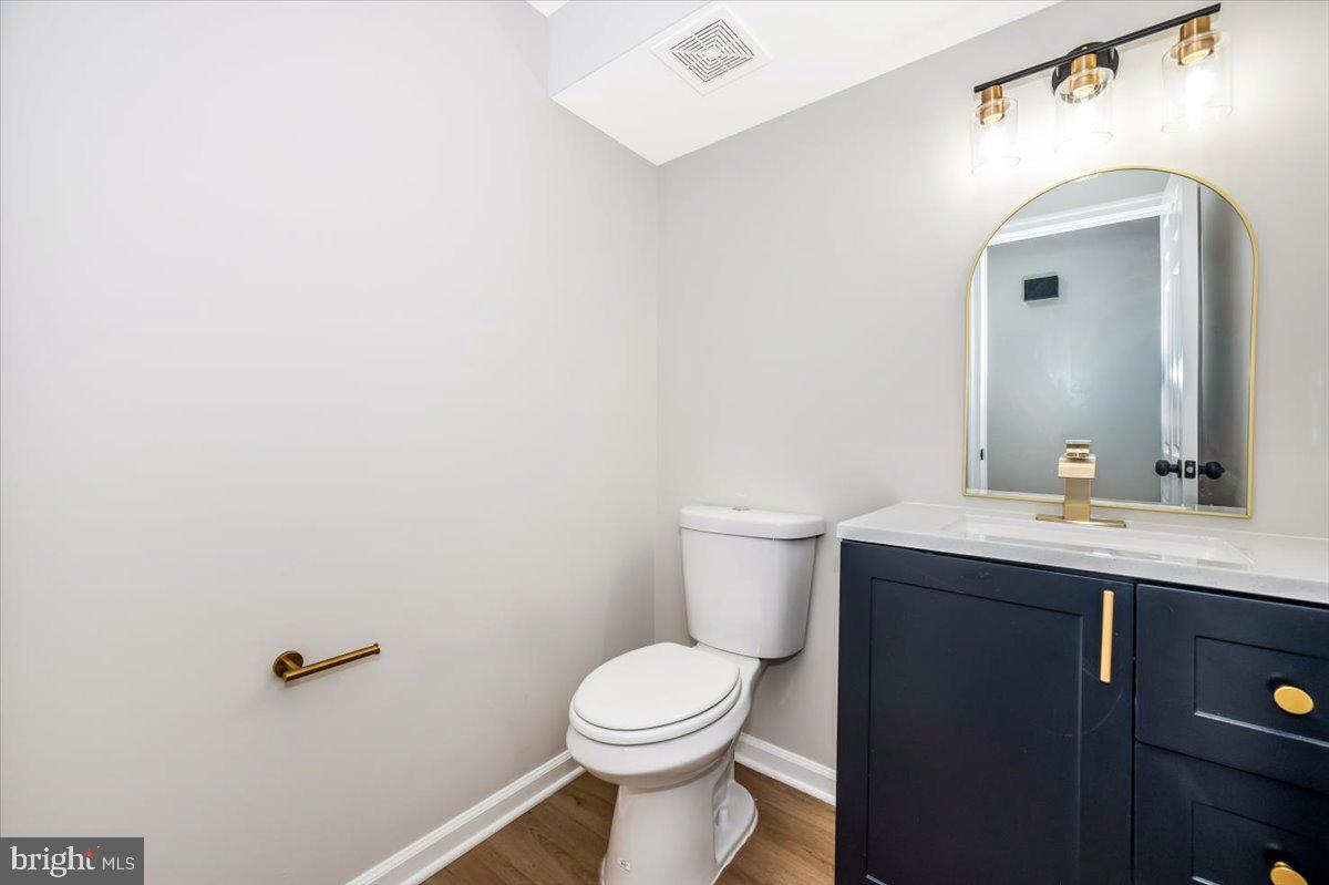 8200 Red Wing Court Frederick, MD 21701 - Photo 15 of 40 a bathroom with a toilet sink and mirror