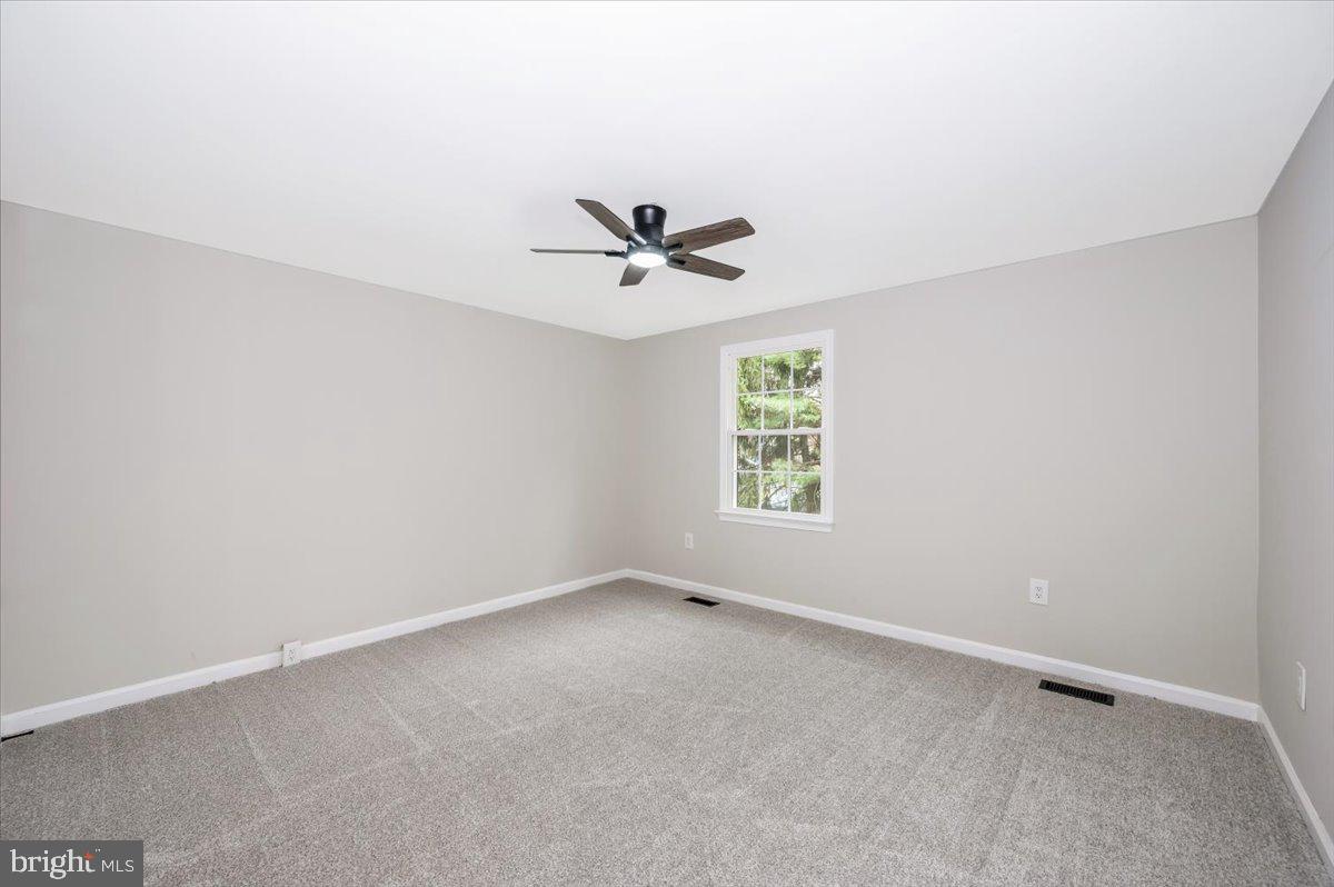 8200 Red Wing Court Frederick, MD 21701 - Photo 17 of 40 an empty room with a ceiling fan and window