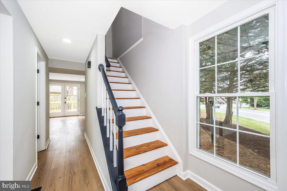 8200 Red Wing Court Frederick, MD 21701 - Photo 2 of 40 a view of a hallway with wooden floor and windows