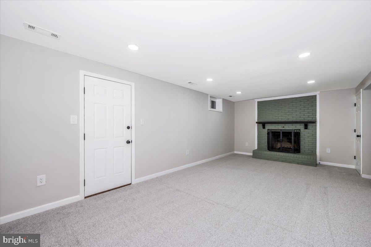 8200 Red Wing Court Frederick, MD 21701 - Photo 29 of 40 a view of empty room with a fireplace