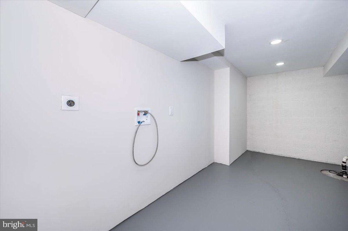 8200 Red Wing Court Frederick, MD 21701 - Photo 33 of 40 a view of a room with racks on the wall