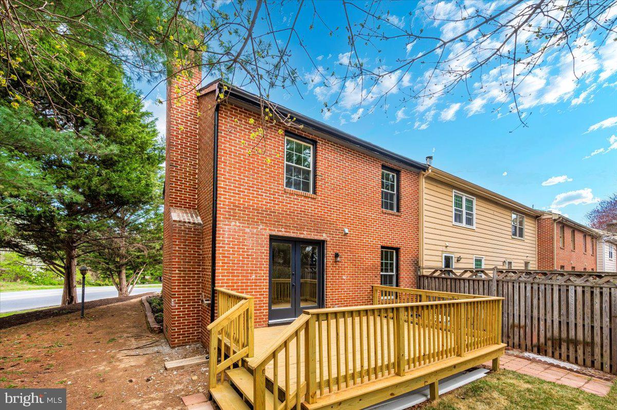 8200 Red Wing Court Frederick, MD 21701 - Photo 35 of 40 a view of a house with a small yard and wooden fence