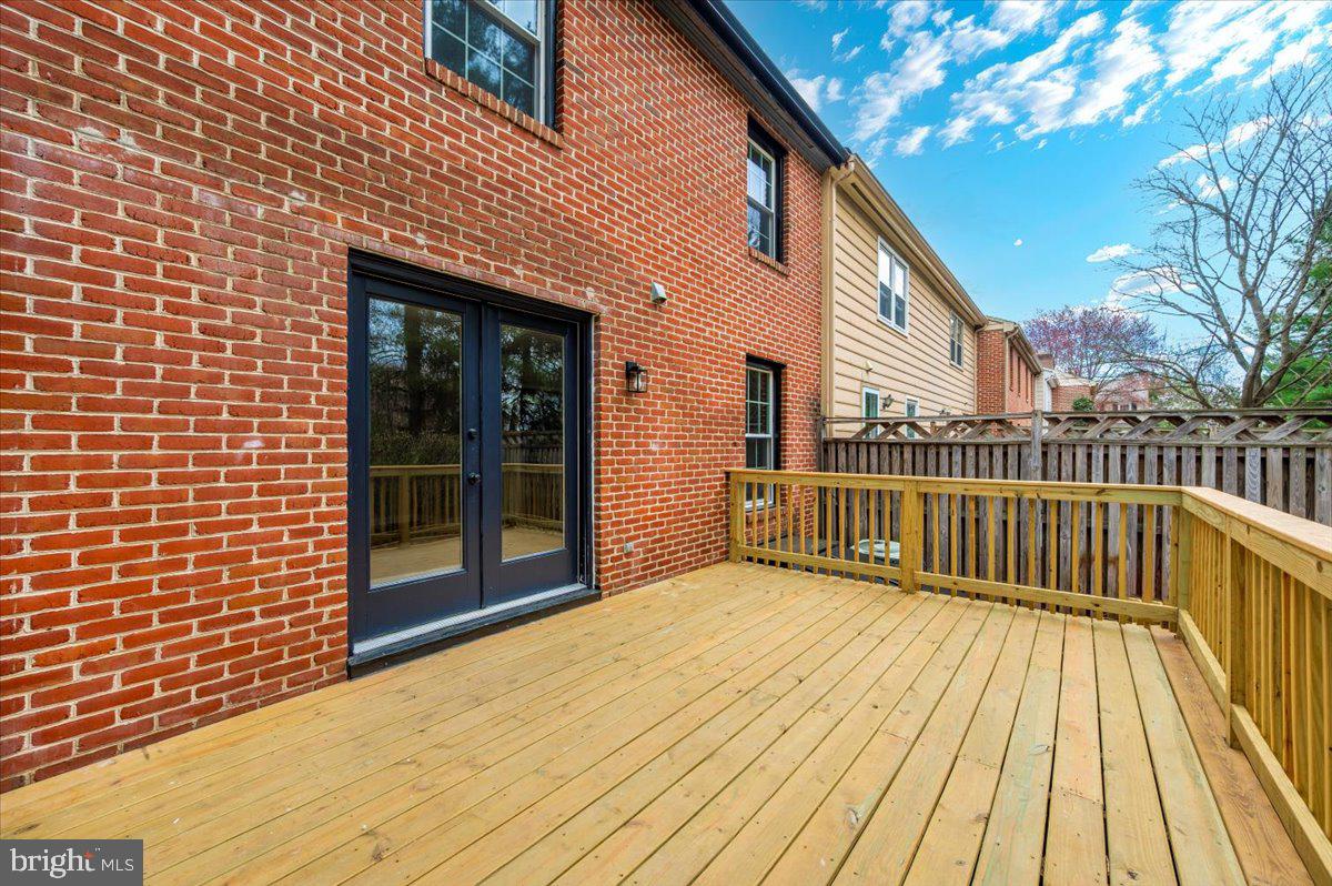 8200 Red Wing Court Frederick, MD 21701 - Photo 38 of 40 a view of a house with a wooden deck