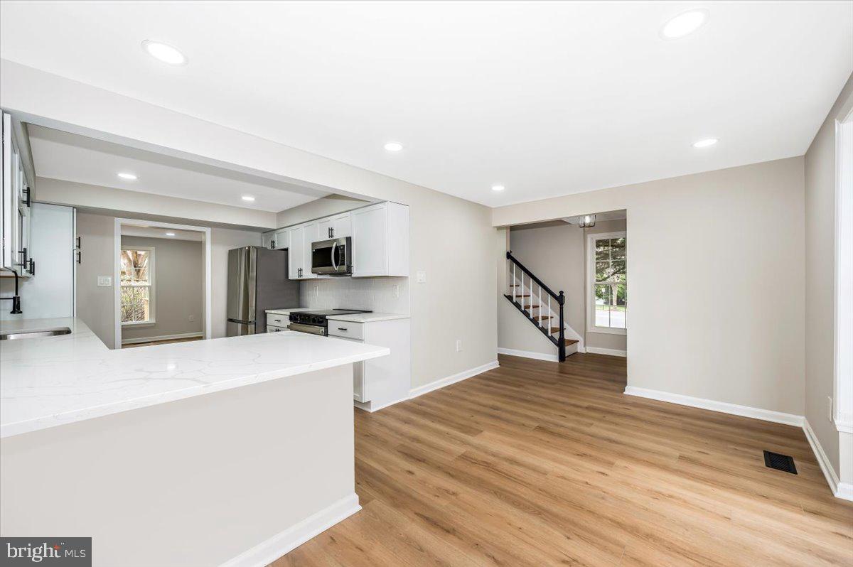 8200 Red Wing Court Frederick, MD 21701 - Photo 5 of 40 a view of kitchen with cabinets and wooden floor