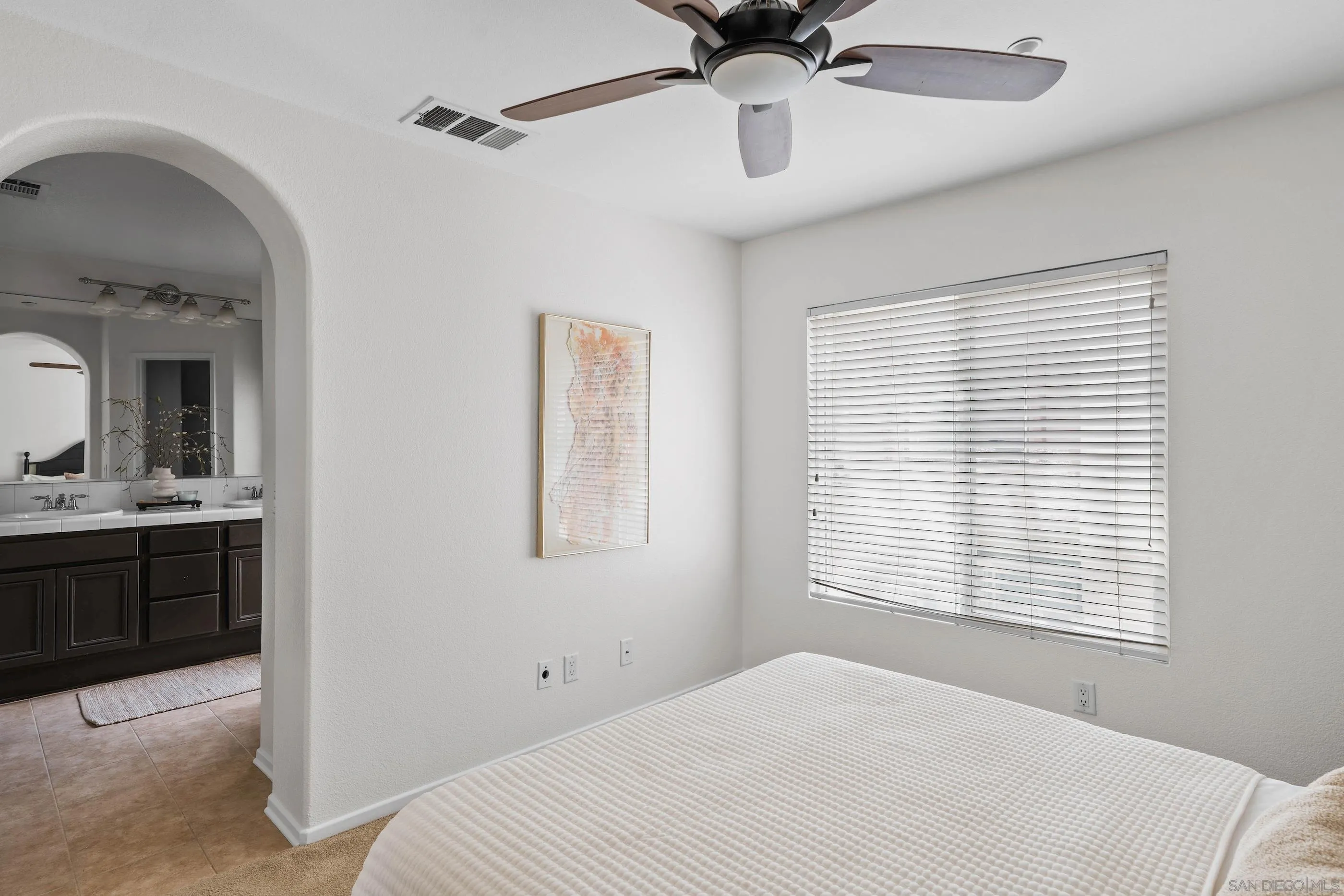 489 Almond Road San Marcos, CA 92078 - Photo 13 of 25 a bedroom with a large bed and a window