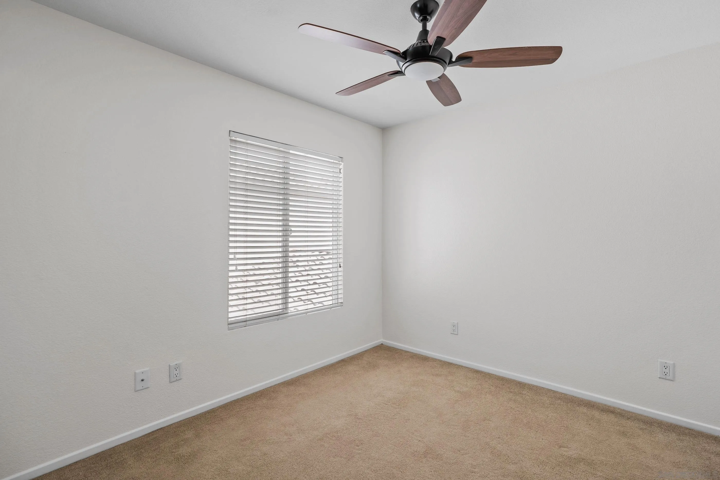 489 Almond Road San Marcos, CA 92078 - Photo 16 of 25 an empty room with a window and a fan