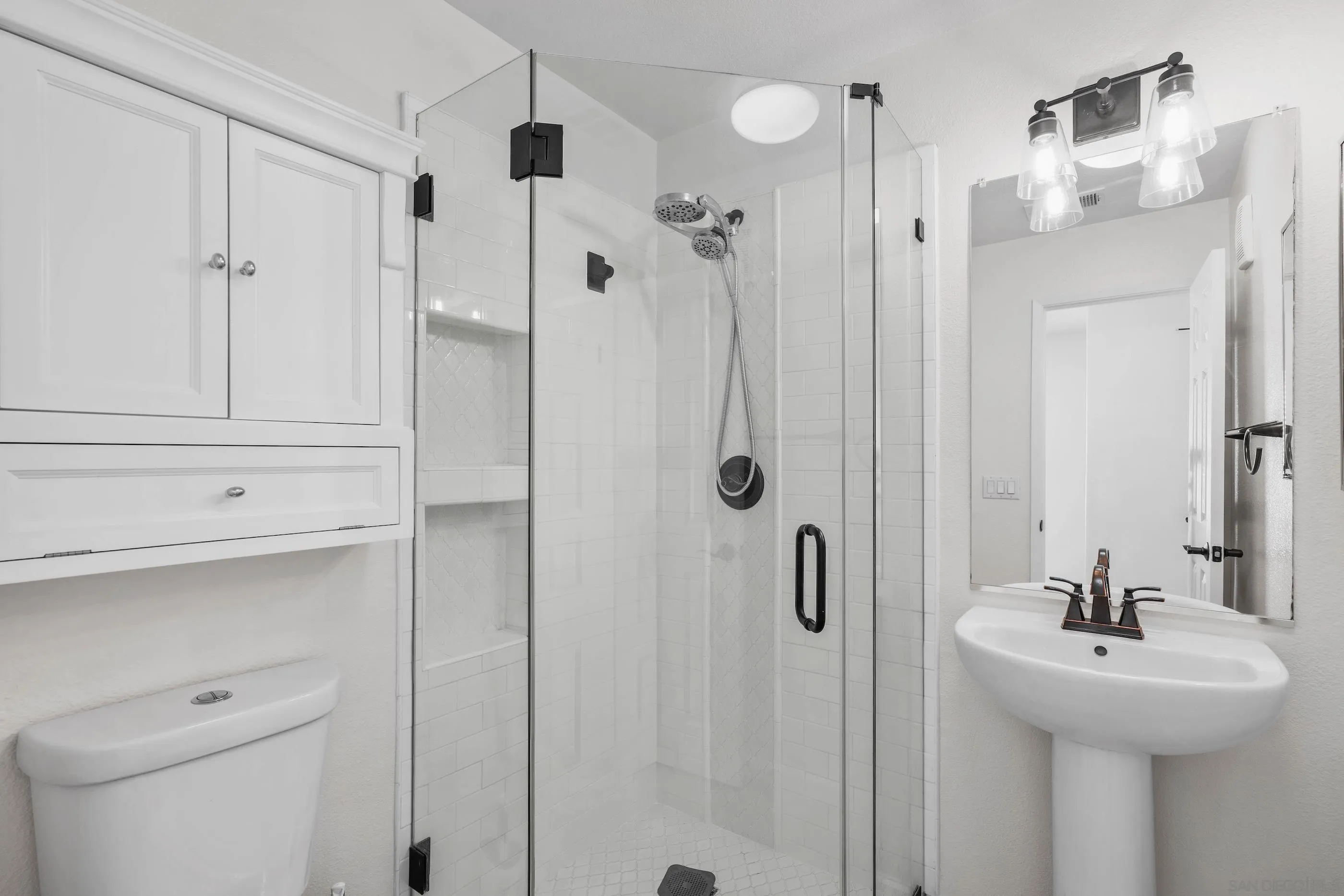 489 Almond Road San Marcos, CA 92078 - Photo 17 of 25 a bathroom with a sink a toilet and shower