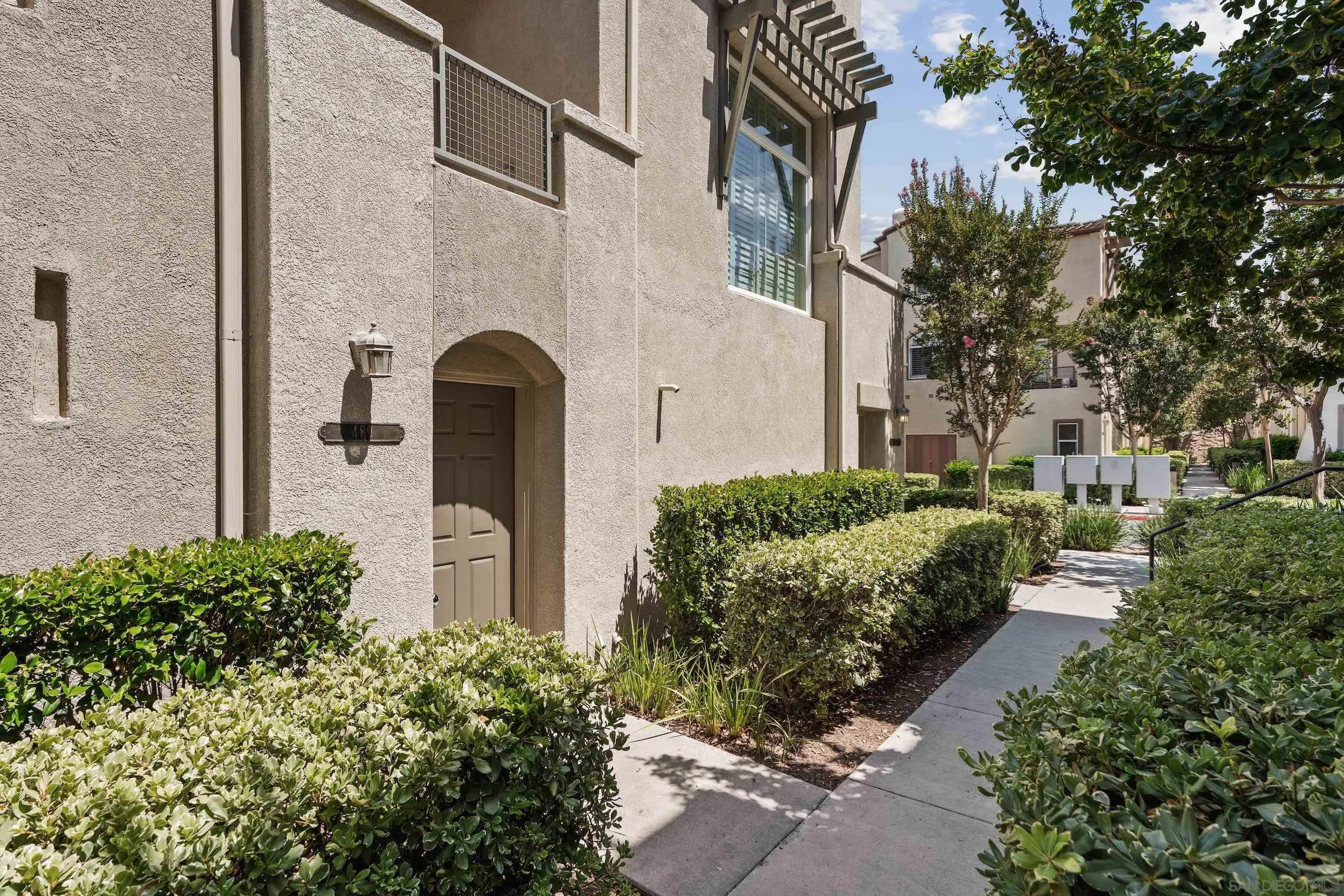 489 Almond Road San Marcos, CA 92078 - Photo 23 of 25 a front view of a house with a garden