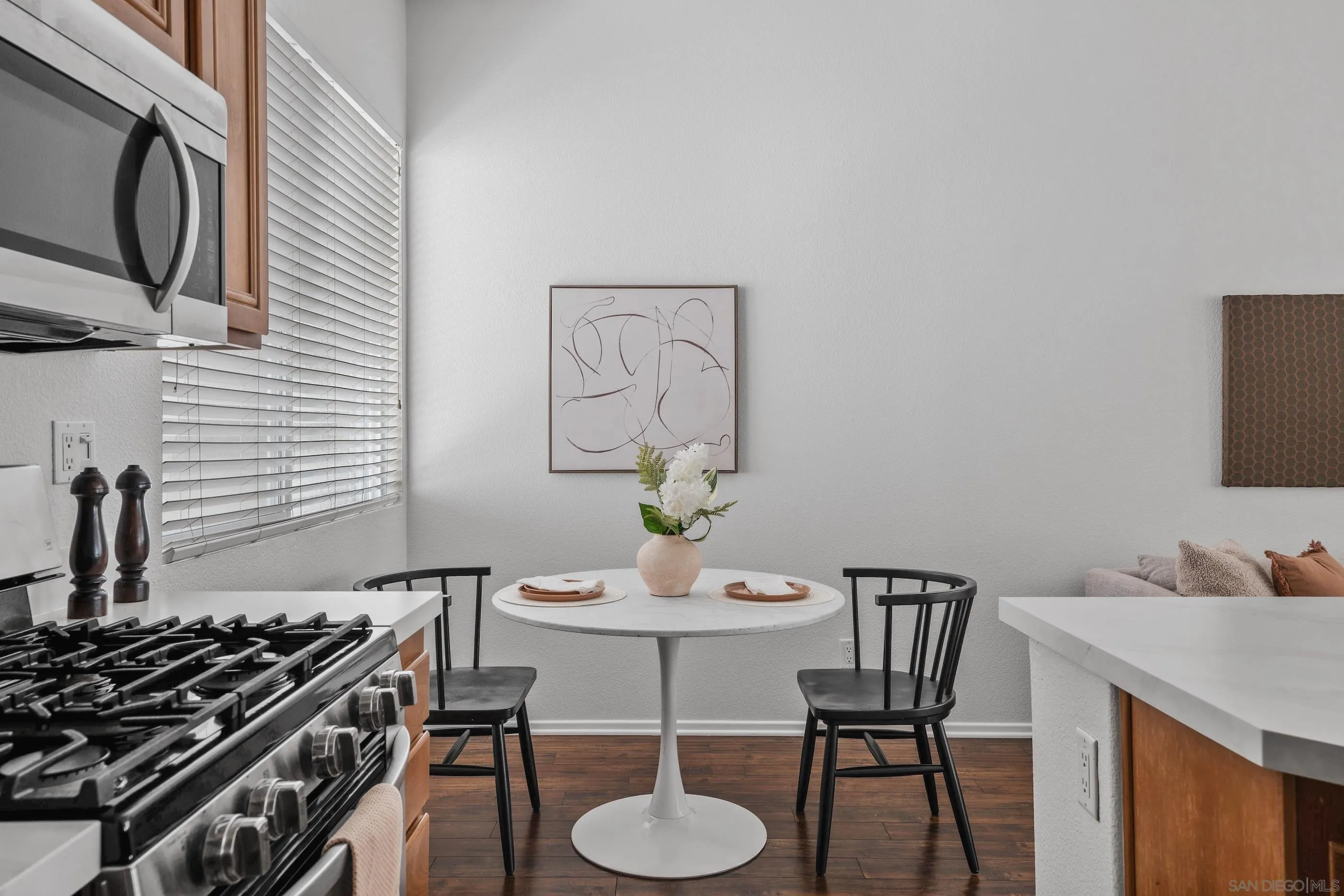 489 Almond Road San Marcos, CA 92078 - Photo 8 of 25 a view of a dining room with furniture and wooden floor