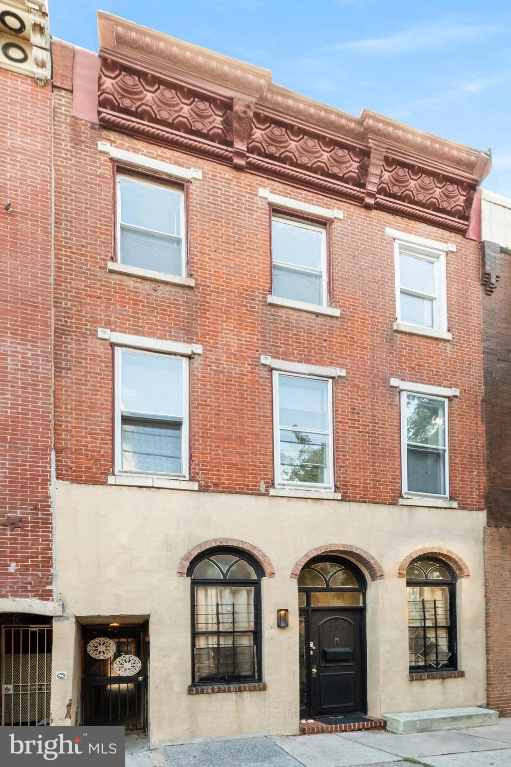 234 Bainbridge Street, Unit 2F Philadelphia, PA 19147 - Photo 9 of 10 a front view of a house with large parking space