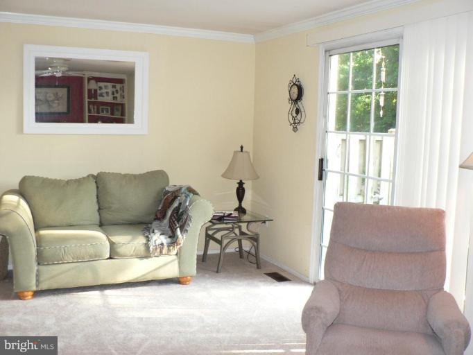 17506 Kohlhoss Road Poolesville, MD 20837 - Photo 8 of 17 Living room opens to private backyard patio