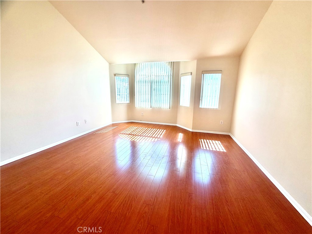 631-ave Fairview, Unit A Arcadia, CA 91006 - Photo 13 of 14 a view of an empty room with wooden floor and a window